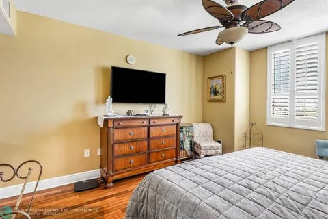 a bathroom with a double sink shower and a mirror