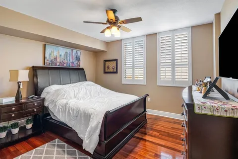 a living room with furniture window and wooden floor
