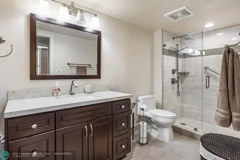 a bathroom with a sink a mirror and a toilet