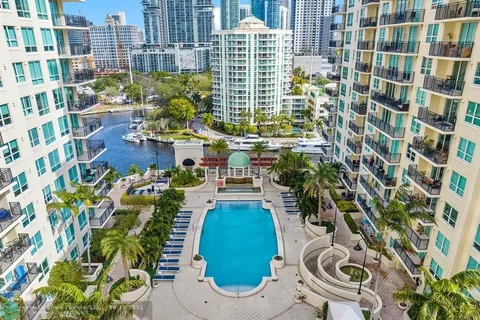 a living room with a couch and a chandelier