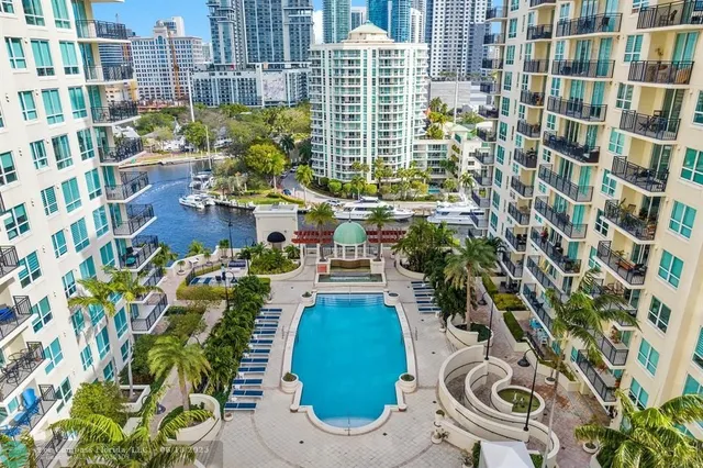 a living room with a couch and a chandelier