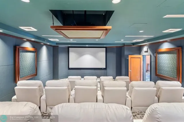 a view of roof deck with table and chairs couches with wooden floor