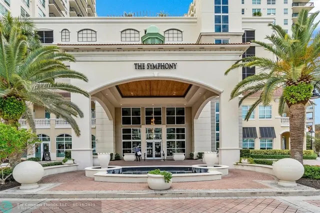 a sign that is sitting on a brick wall