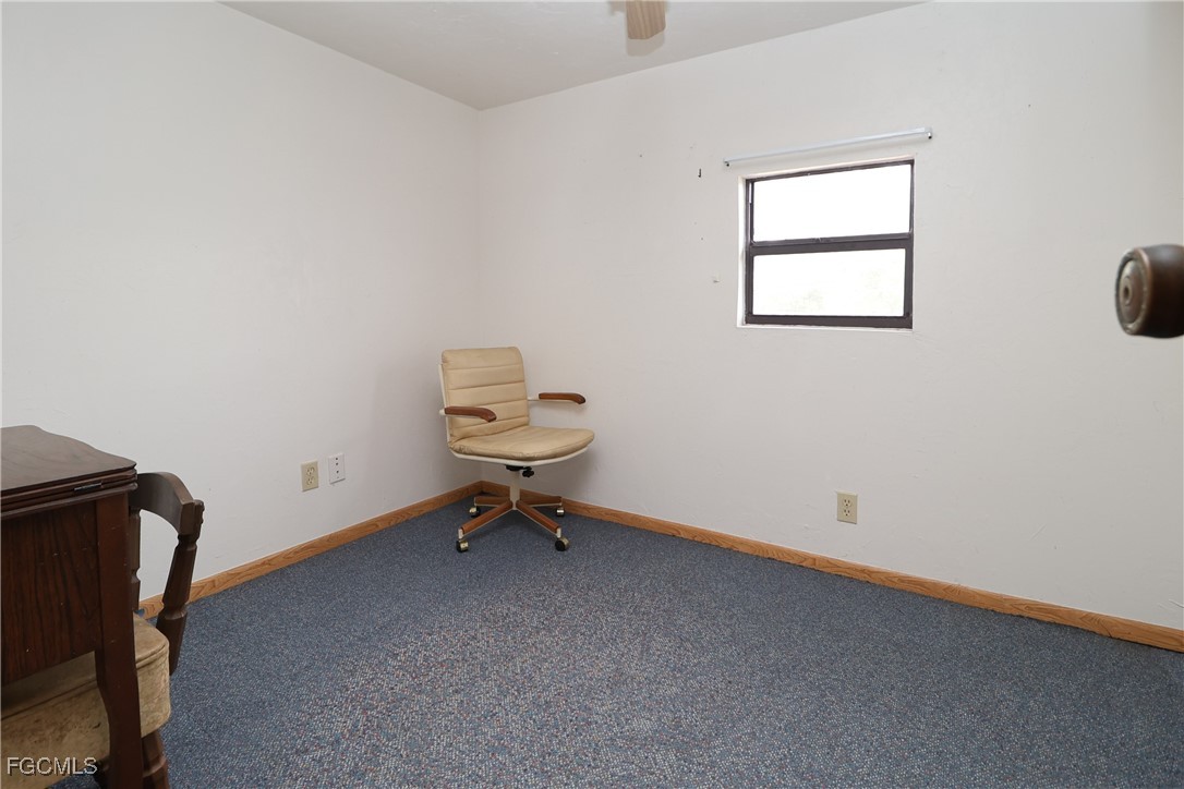 6620 Golden Road North Fort Myers, FL 33917 - Photo 18 of 26 a view of a room with wooden floor and a window