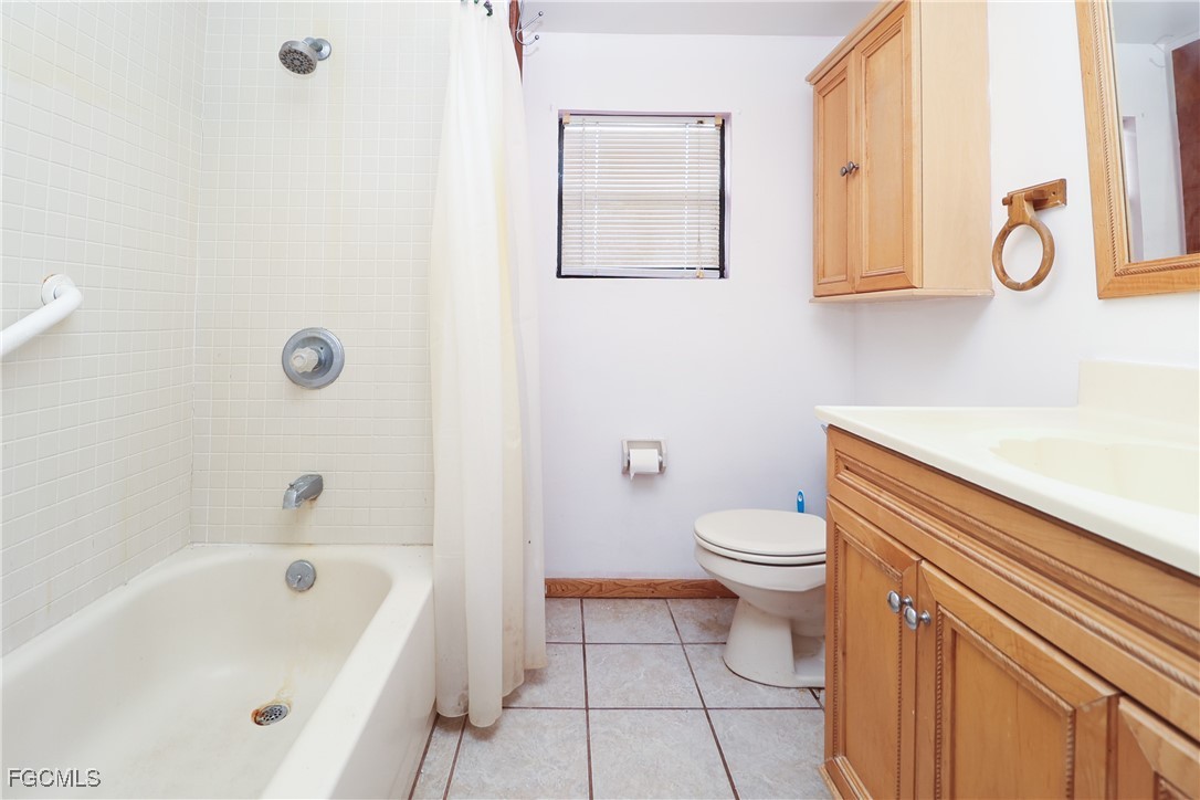 6620 Golden Road North Fort Myers, FL 33917 - Photo 19 of 26 a bathroom with a sink a toilet and shower