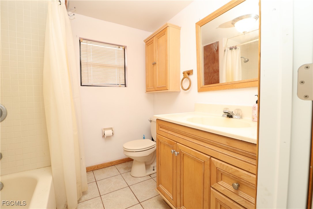 6620 Golden Road North Fort Myers, FL 33917 - Photo 20 of 26 a bathroom with a sink a toilet and a mirror
