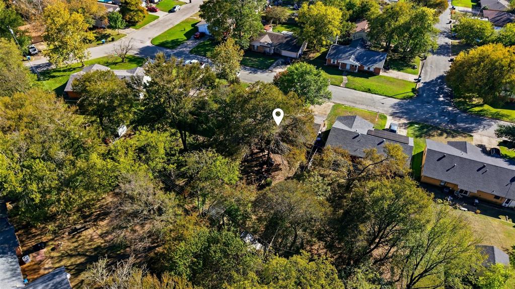 145 Bob White Road Denison, TX 75020 - Photo 18 of 24 an aerial view of residential house with yard and outdoor seating