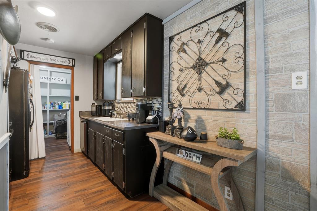 145 Bob White Road Denison, TX 75020 - Photo 2 of 24 a kitchen with stainless steel appliances granite countertop a stove a sink dishwasher and a refrigerator