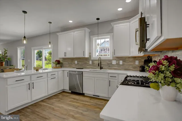 a kitchen with sink cabinets and window