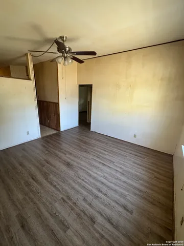 a view of a hallway with seating area