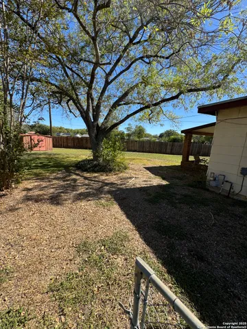a view of a backyard of the house