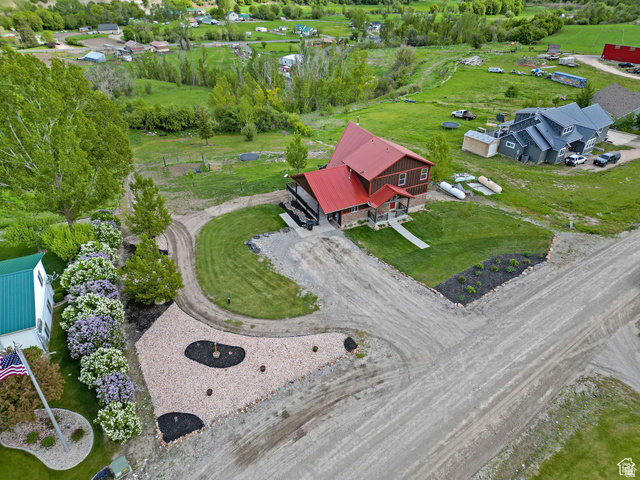 306 Spring Road Preston, ID 83263 - Photo 37 of 55 Two-story residence featuring a red metal roof and wood siding