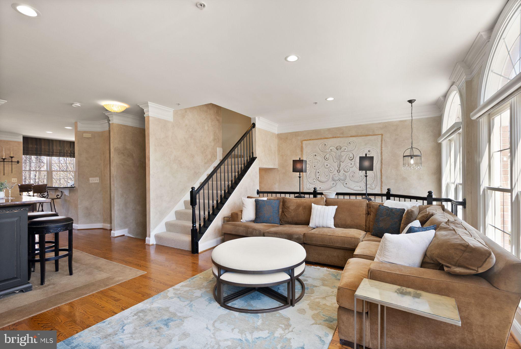 4132 Timber Log Way Fairfax, VA 22030 - Photo 20 of 69 a living room with furniture and a dining table with wooden floor
