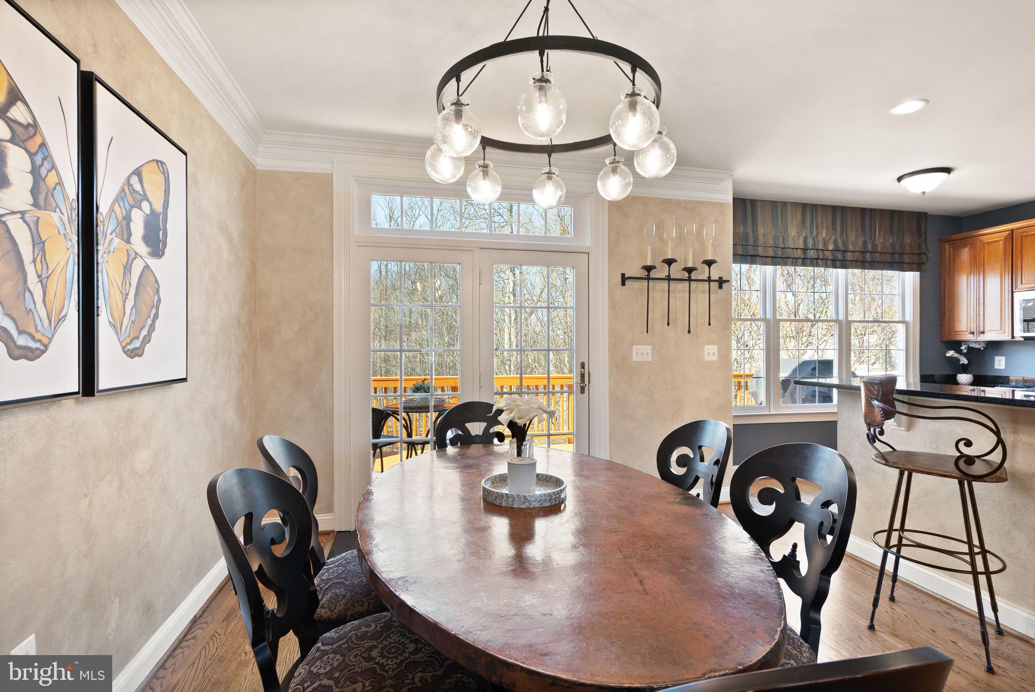 4132 Timber Log Way Fairfax, VA 22030 - Photo 24 of 69 a view of a dining room with furniture and wooden floor