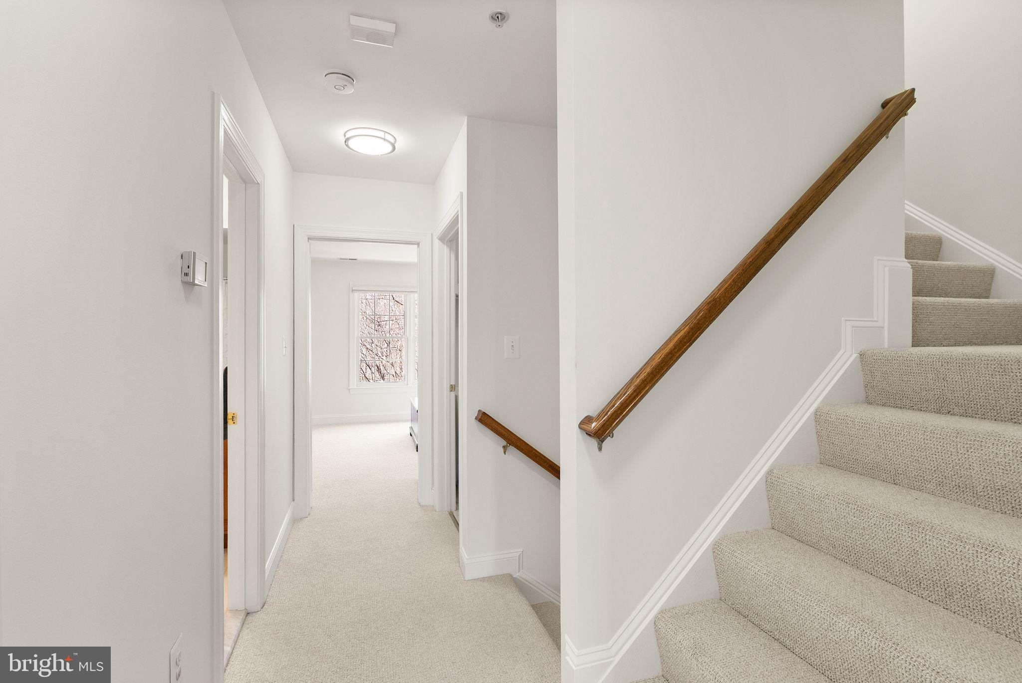 4132 Timber Log Way Fairfax, VA 22030 - Photo 35 of 69 a view of staircase with white walls and white walls