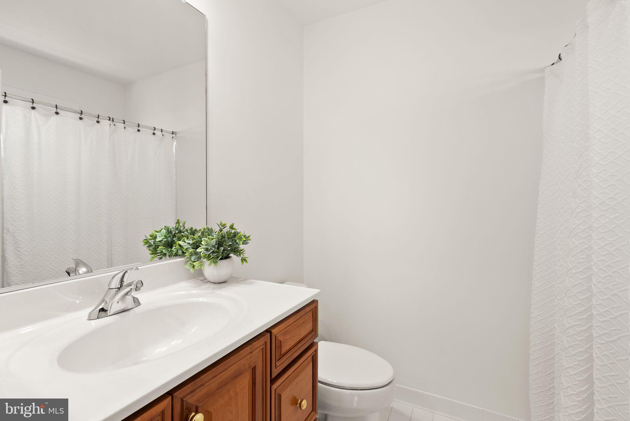4132 Timber Log Way Fairfax, VA 22030 - Photo 43 of 69 a bathroom with a sink toilet and vanity