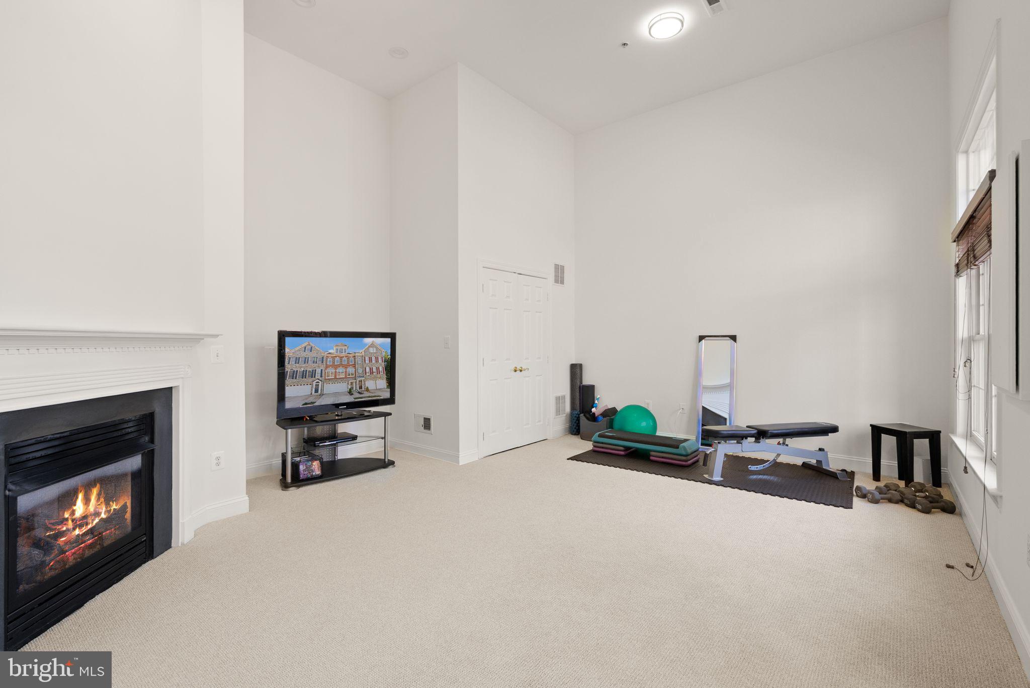4132 Timber Log Way Fairfax, VA 22030 - Photo 55 of 69 a bedroom with furniture and a flat screen tv