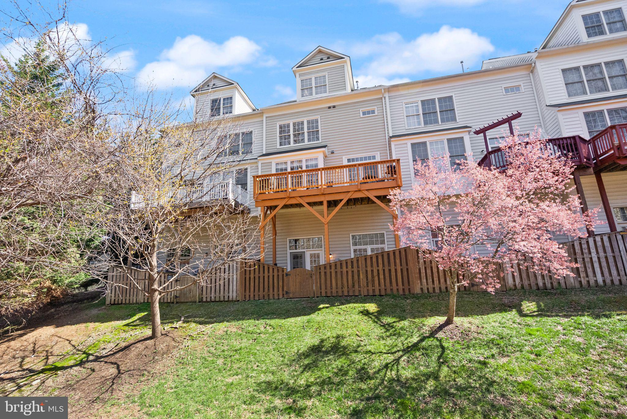 4132 Timber Log Way Fairfax, VA 22030 - Photo 60 of 69 a front view of a house with a garden