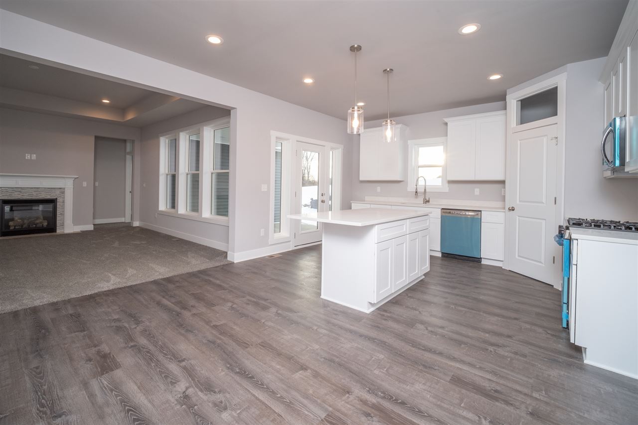 2435 Court Ridge Road Belvidere, IL 61008 - Photo 5 of 20 a large kitchen with cabinets and wooden floor