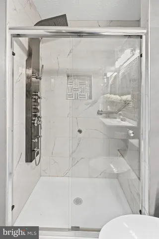 a bathroom with a bathtub and a shower