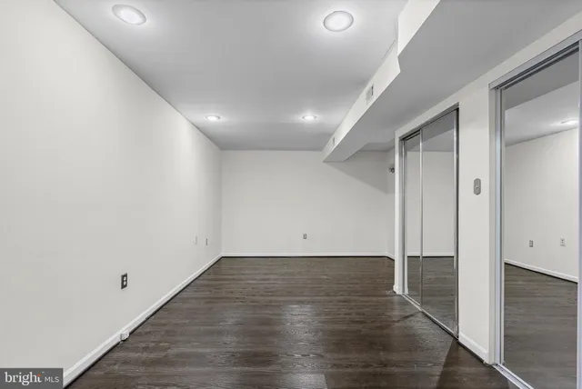 an empty room with wooden floor