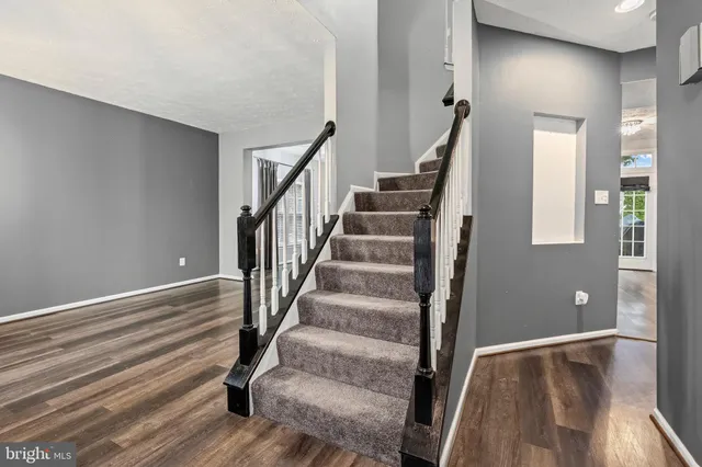 a view of entryway with wooden floor