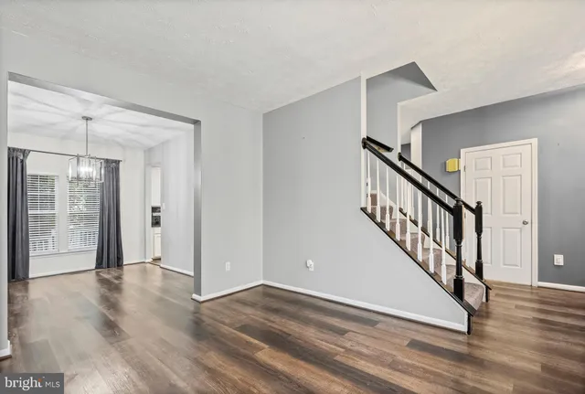 a view of an entryway with wooden floor