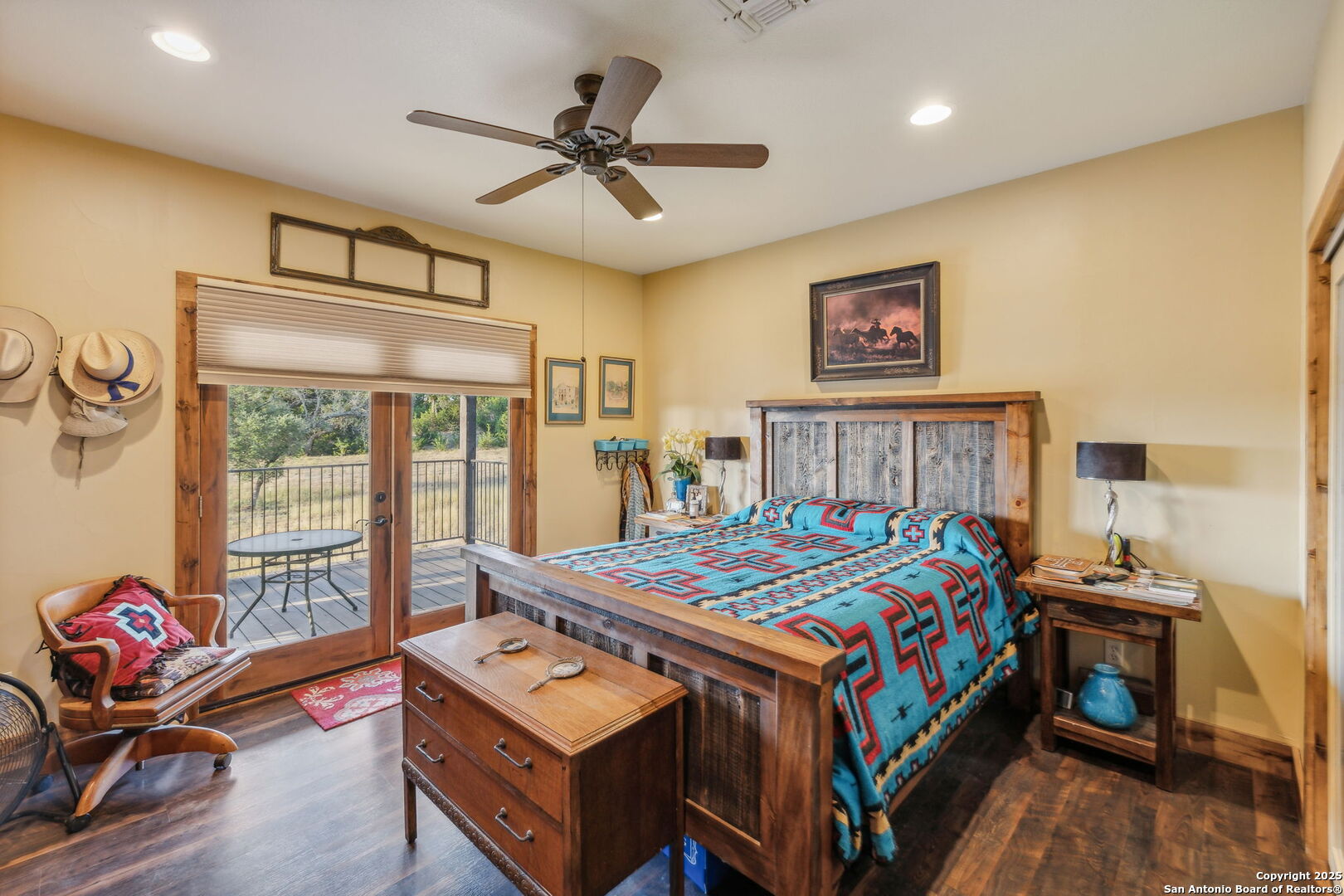 232 Stoneleigh Road Center Point, TX 78010 - Photo 12 of 34 a bedroom with a bed a couch and a window