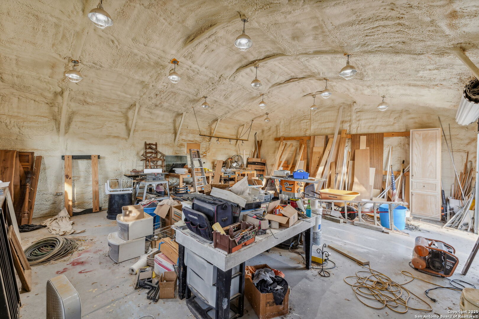232 Stoneleigh Road Center Point, TX 78010 - Photo 22 of 34 a living room with lots of furniture and a chandelier