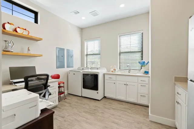 a kitchen with a stove a sink and a refrigerator