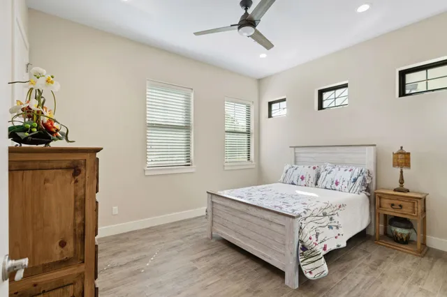 a bedroom with a bed and a dresser