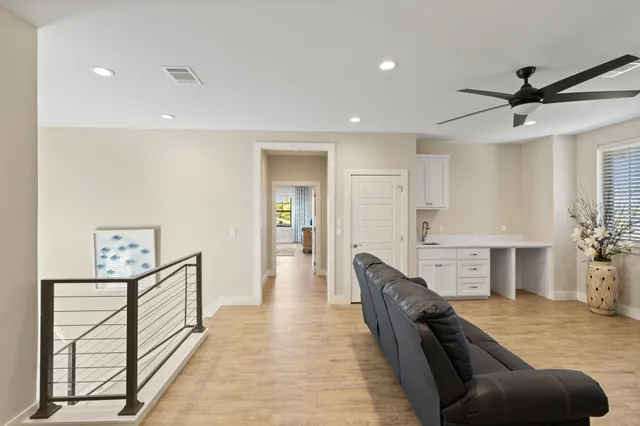 a bedroom with a bed bathroom and a sink