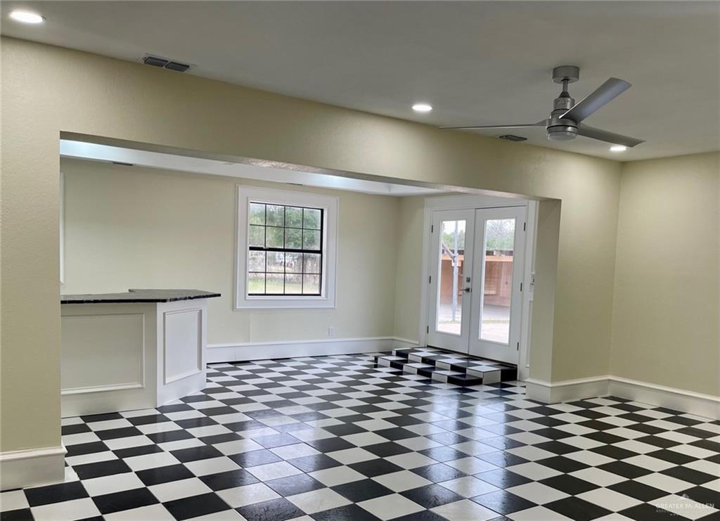5307 Fm 493 Road Donna, TX 78537 - Photo 15 of 27 Unfurnished room with dark tile floors, french doors, and plenty of natural light