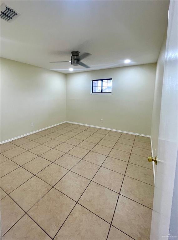 5307 Fm 493 Road Donna, TX 78537 - Photo 18 of 27 Spare room featuring light tile flooring and ceiling fan