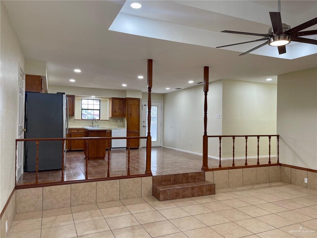 5307 Fm 493 Road Donna, TX 78537 - Photo 9 of 27 Kitchen featuring white dishwasher, light tile floors, stainless steel fridge, ceiling fan, and sink