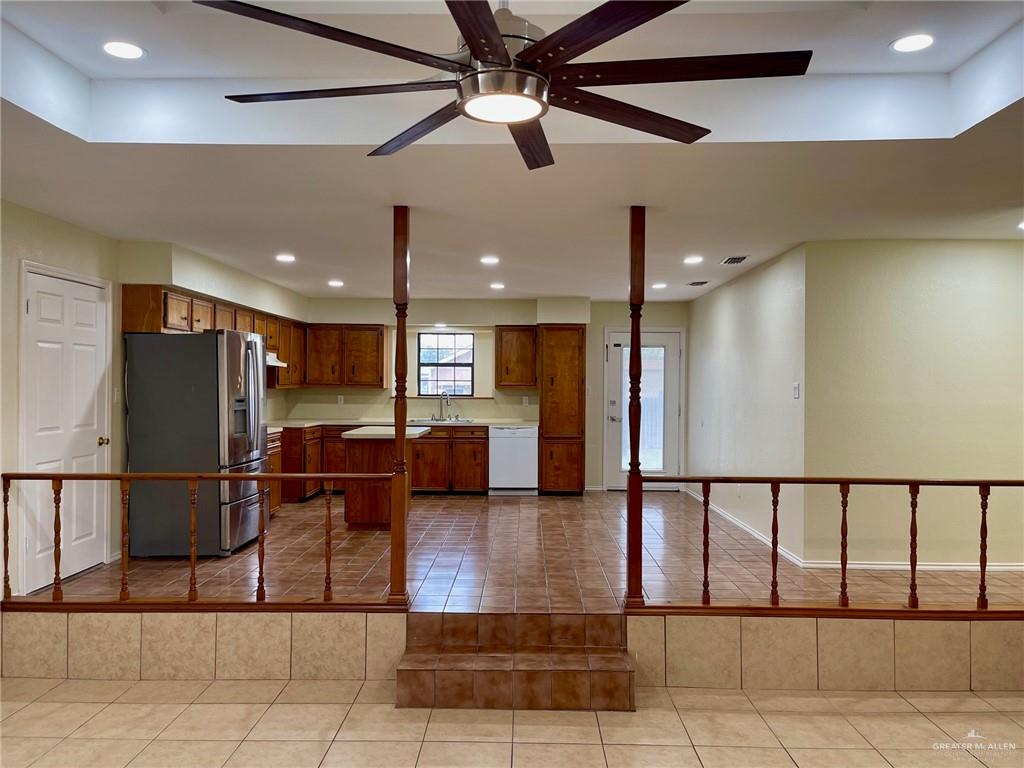 5307 Fm 493 Road Donna, TX 78537 - Photo 10 of 27 Kitchen with ceiling fan, light tile floors, stainless steel refrigerator with ice dispenser, dishwasher, and sink
