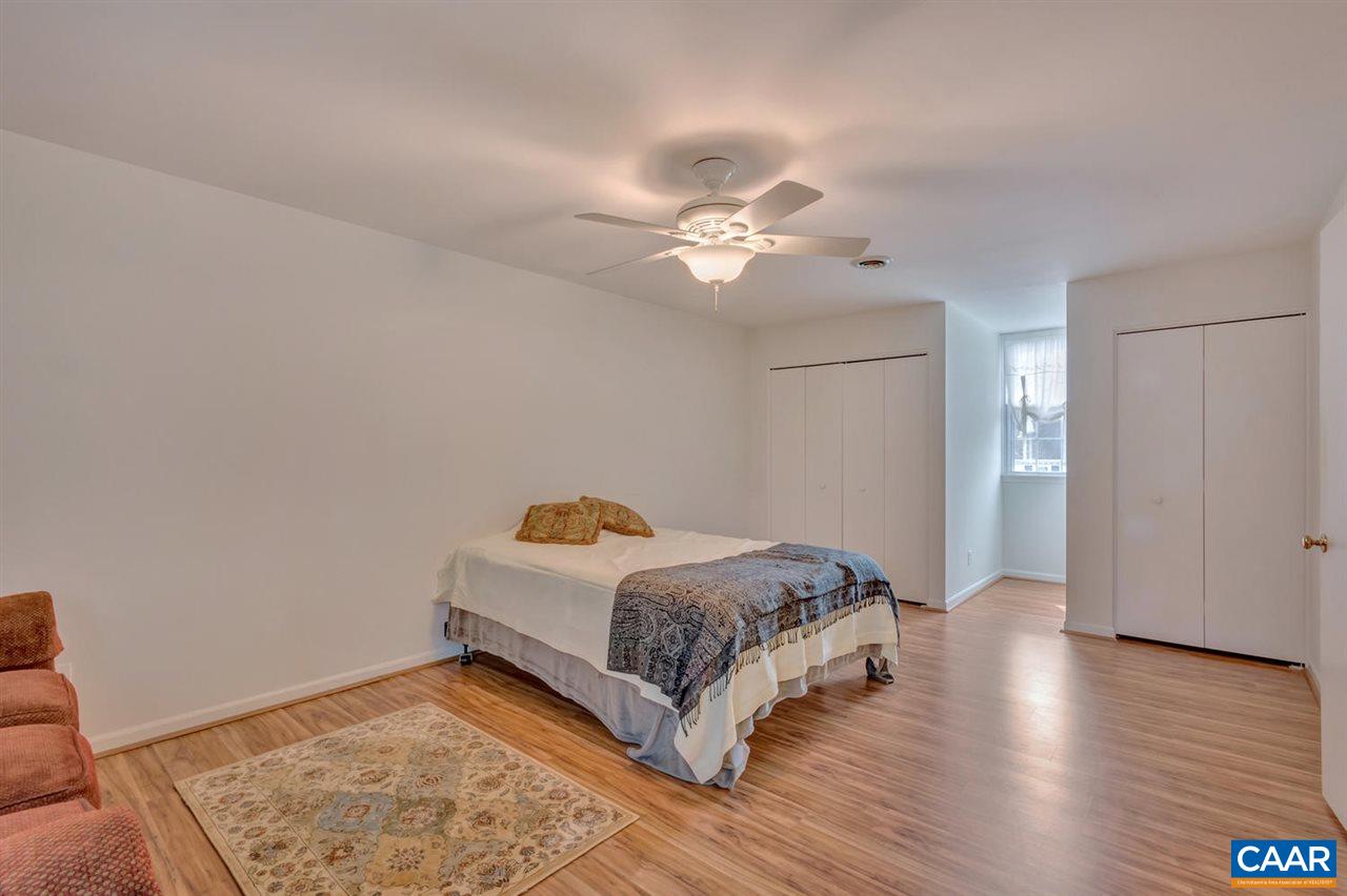 321 North Bennington Road Charlottesville, VA 22901 - Photo 18 of 30 a bedroom with a bed and wooden floor