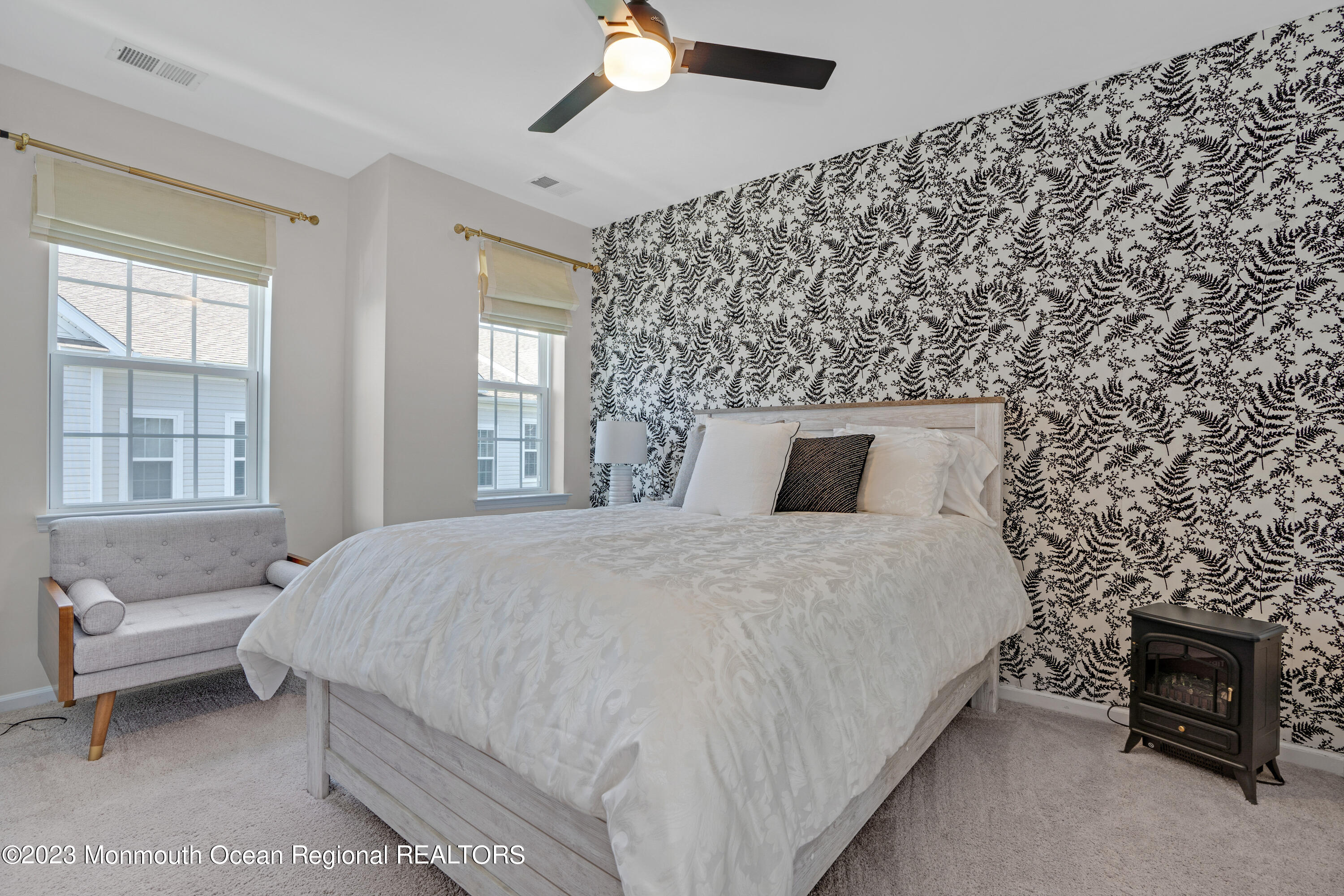 7 Iris Lane, Unit 504 Garfield, NJ 07026 - Photo 24 of 31 a bedroom with a bed and a fireplace