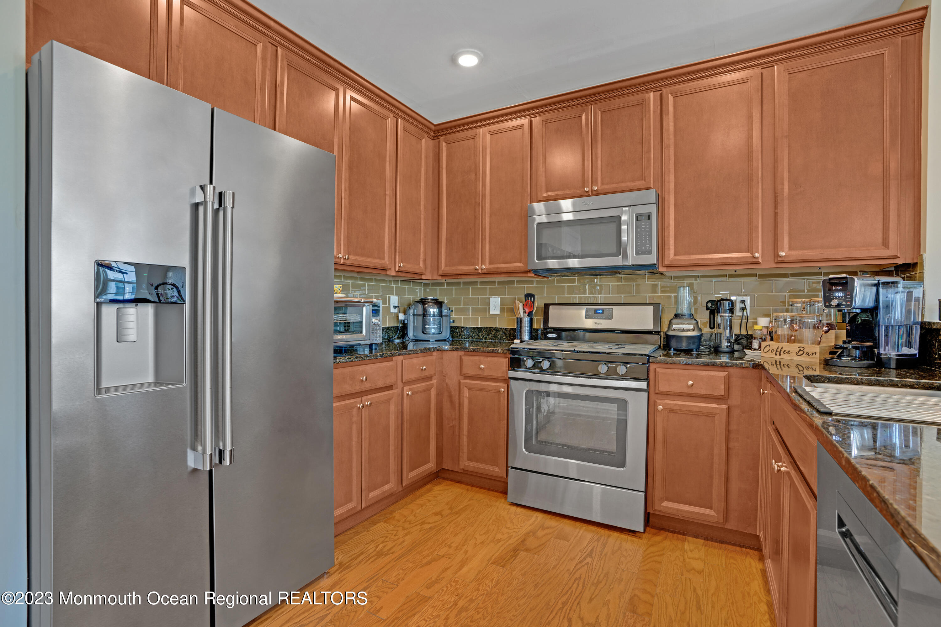 7 Iris Lane, Unit 504 Garfield, NJ 07026 - Photo 9 of 31 a kitchen with stainless steel appliances granite countertop a refrigerator sink and cabinets
