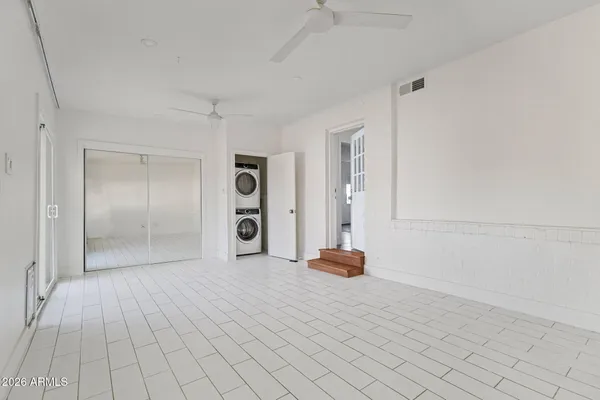 a view of a room with a flat screen tv