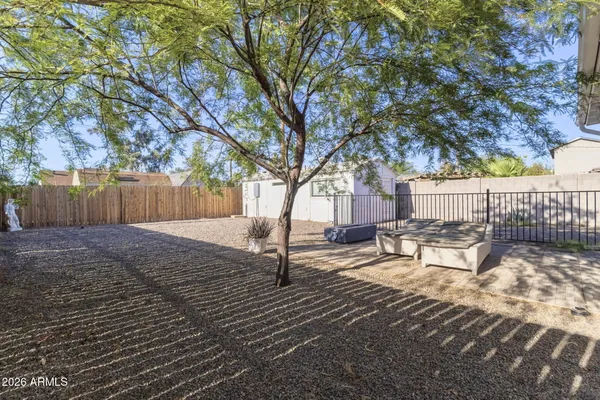 a view of a roof deck with wooden fence