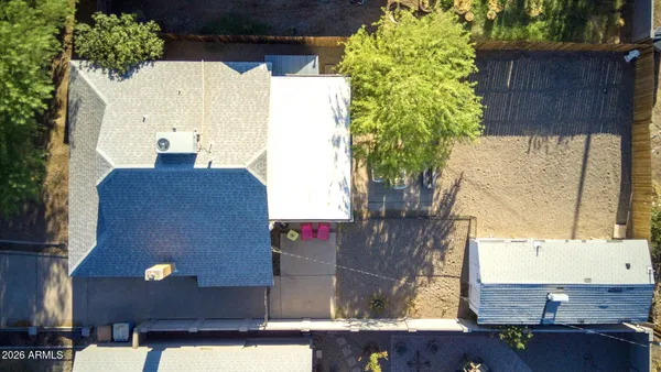 a front view of a building with tree s