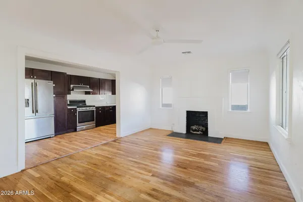 a view of kitchen with a sink and a refrigerator