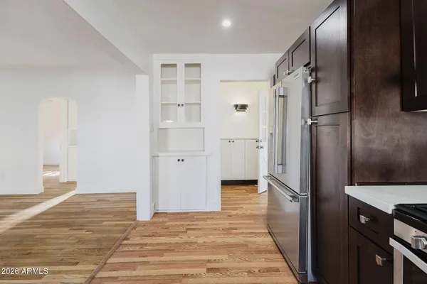 a bathroom with a shower and a glass door
