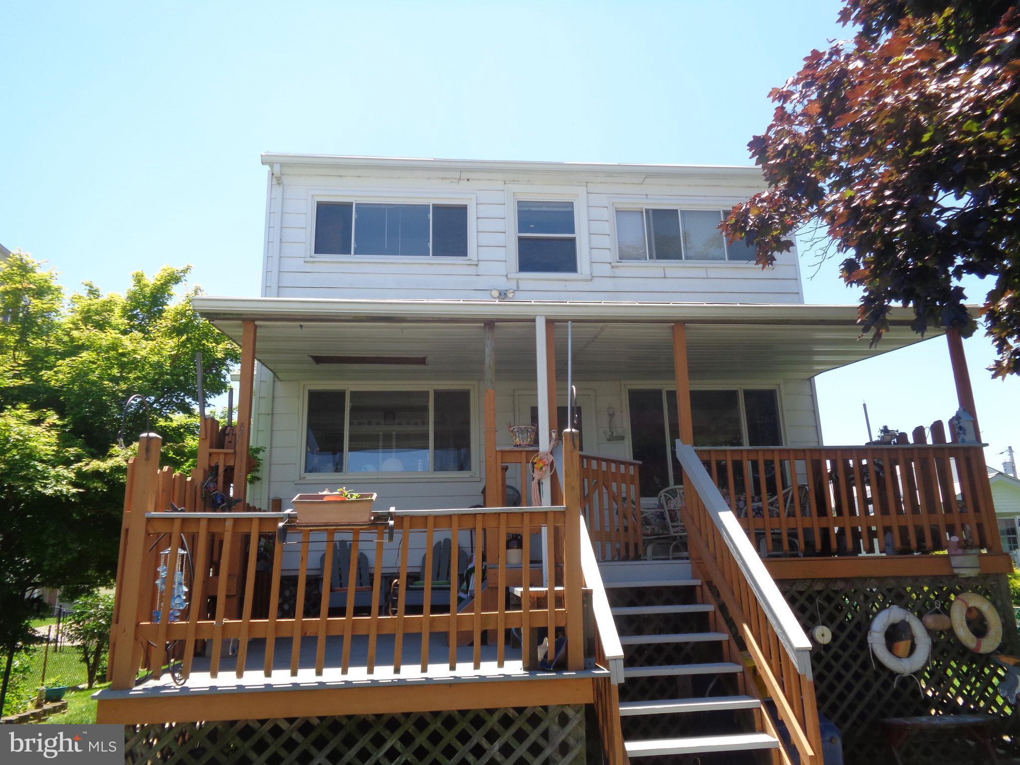 6994 River Drive Road Baltimore, MD 21219 - Photo 3 of 23 a view of a house with a deck and furniture
