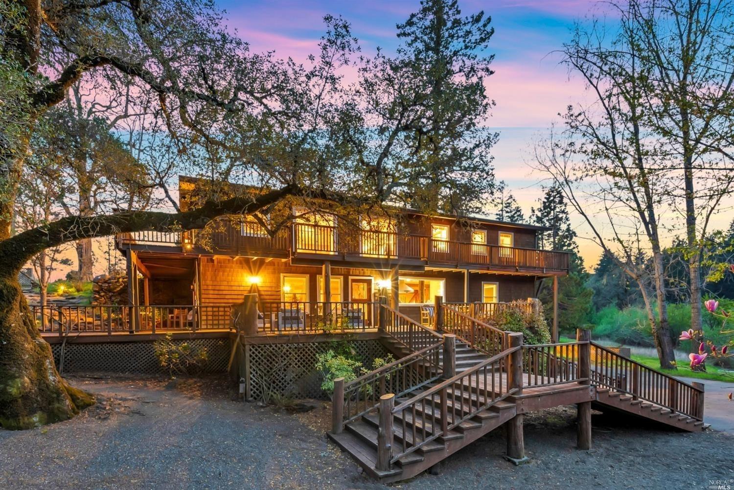 a view of a porch with furniture and tree