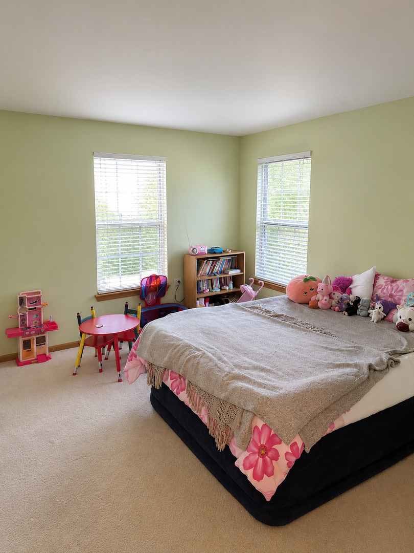 720 Ridge Drive Marengo, IL 60152 - Photo 23 of 34 a bedroom with a bed and window