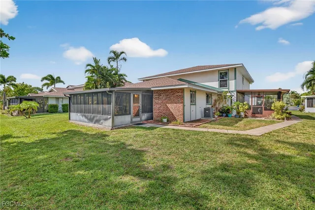 a view of a house with a yard porch and sitting area