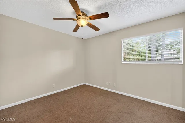 a kitchen with stainless steel appliances a sink a washer and dryer
