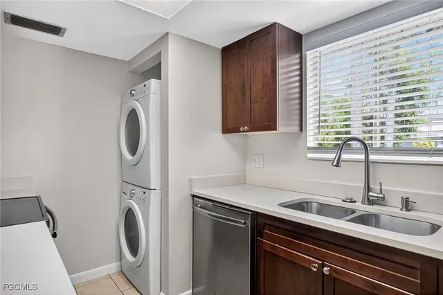 a kitchen with a cabinets a stove and a microwave